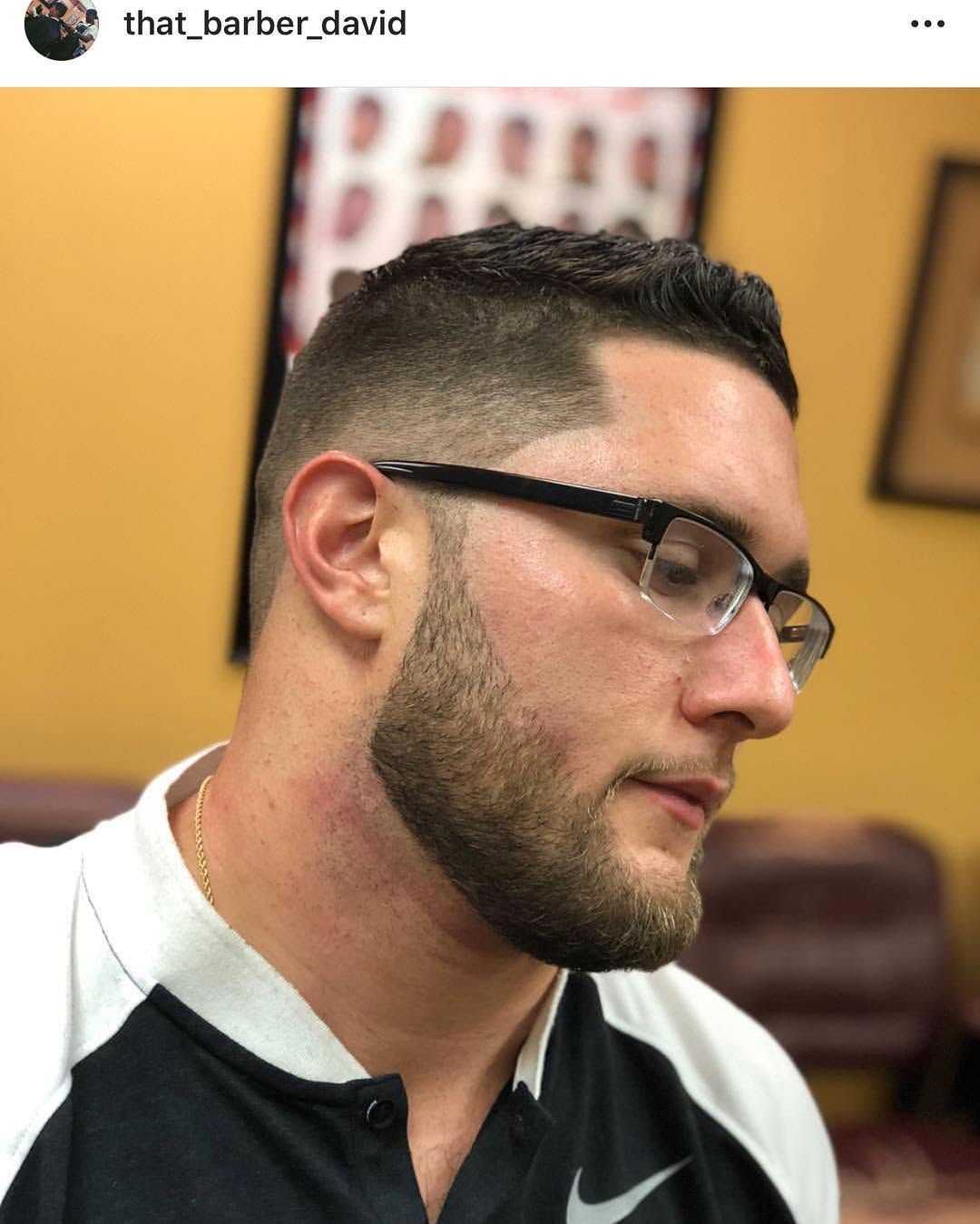 Clean low fade with crisp line and beard