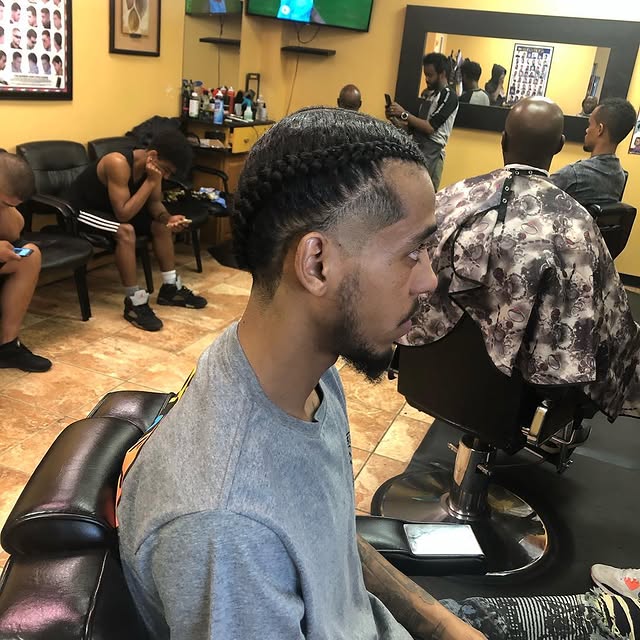 Long braided cornrows with mid fade
